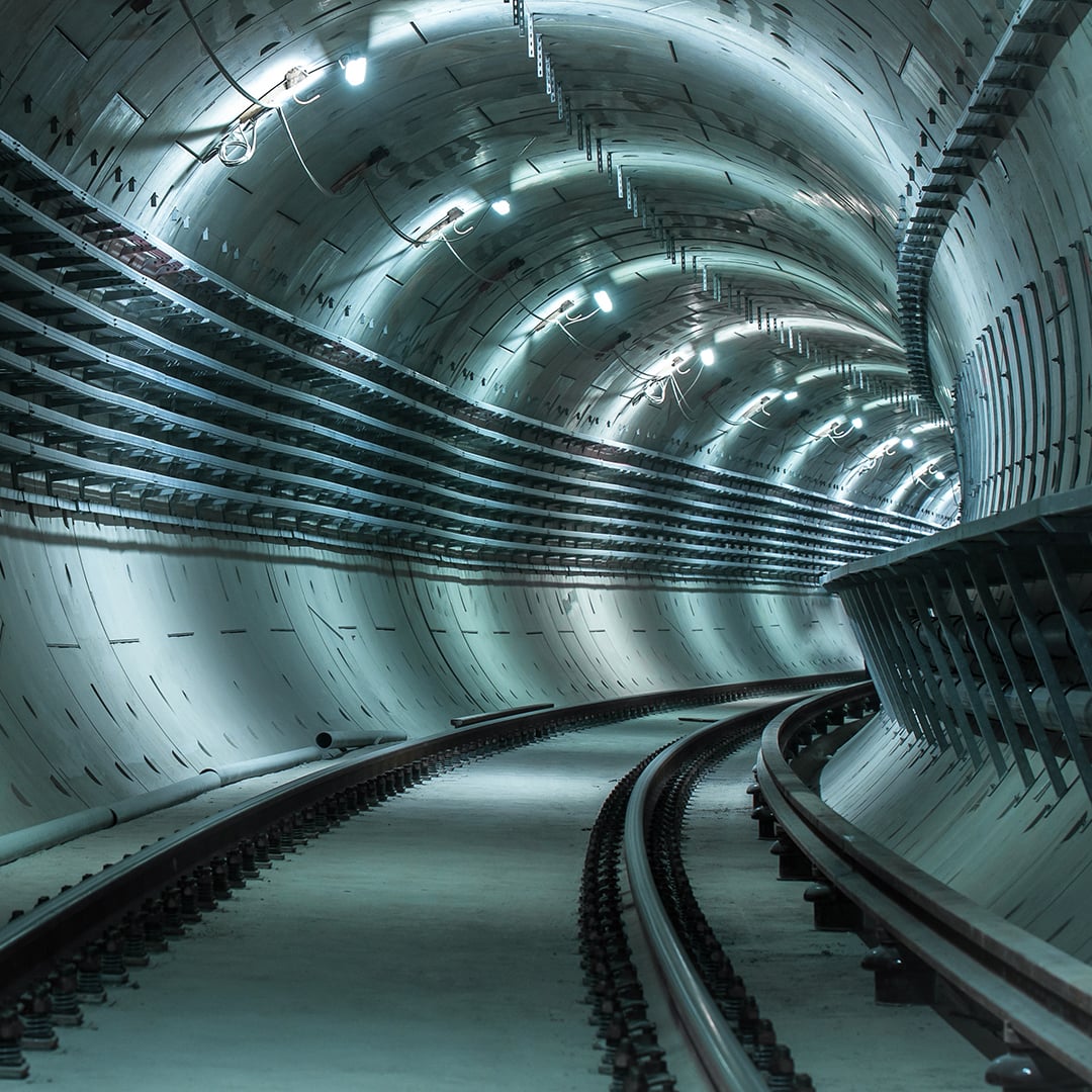 Illuminated underground tunnel representing digital and energy infrastructure across APAC