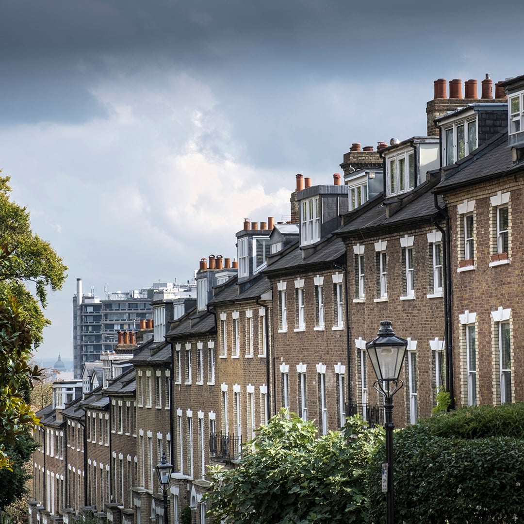 European residential street with brick terraced housing, illustrating housing supply challenges across Europe