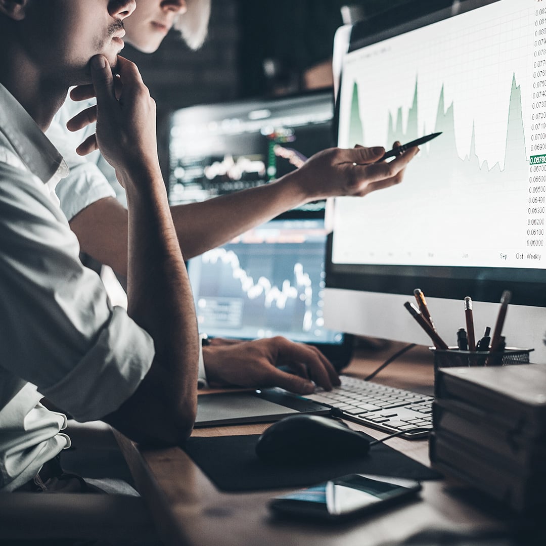 Two people looking at a computer screen