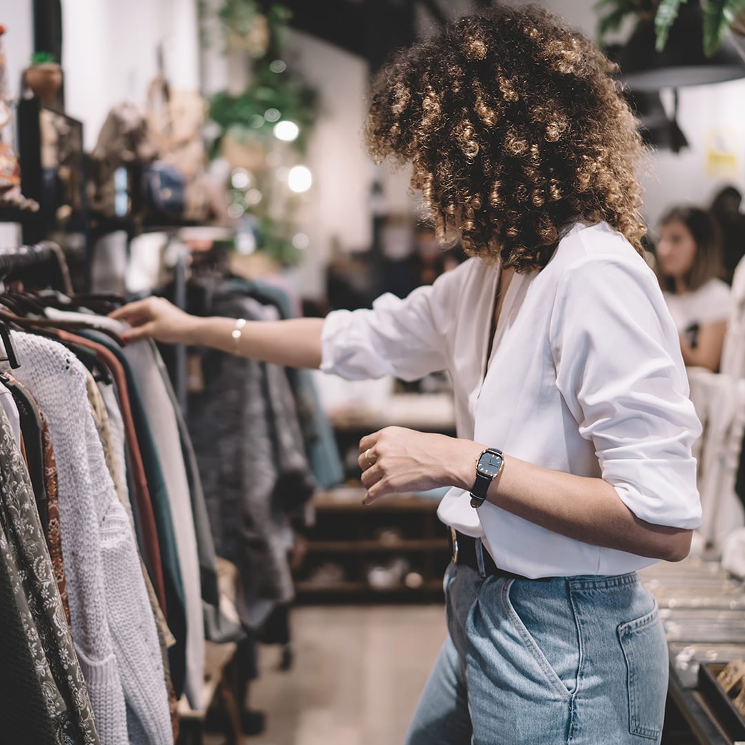 A person looking at clothes on swingers