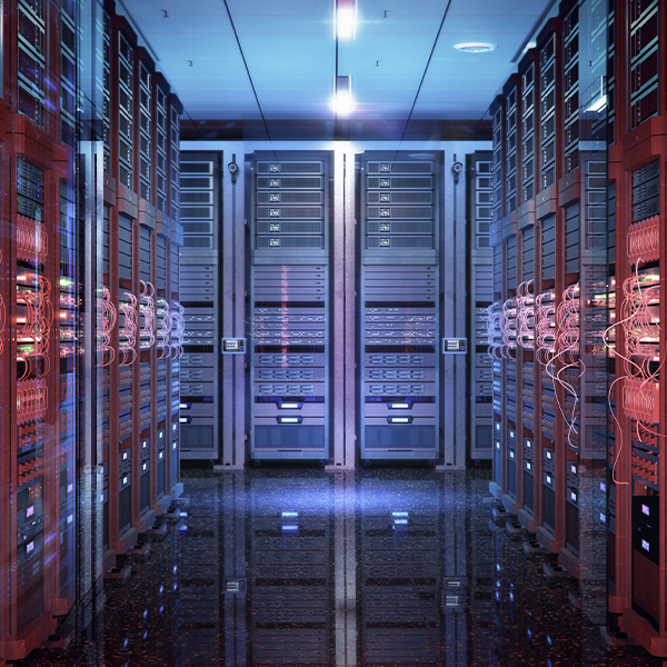 High-density data center interior with server racks and network cabling supporting mission-critical commercial infrastructure.