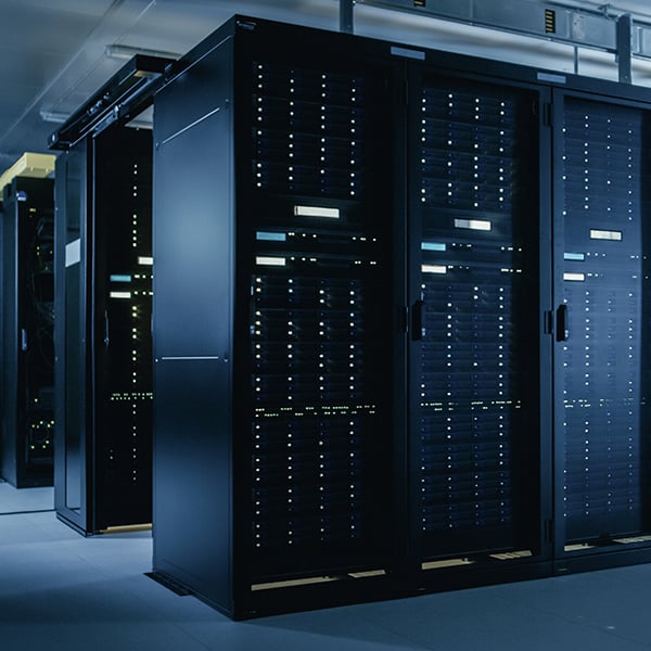 High-density data center with server cabinets and network equipment supporting mission-critical commercial infrastructure.