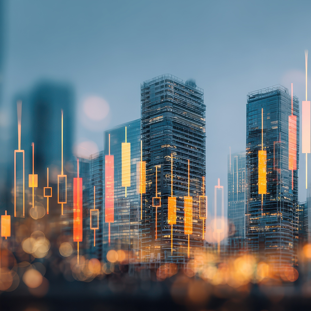 Commercial real estate skyline with illuminated high-rise buildings and financial candlestick chart overlay representing market trends.