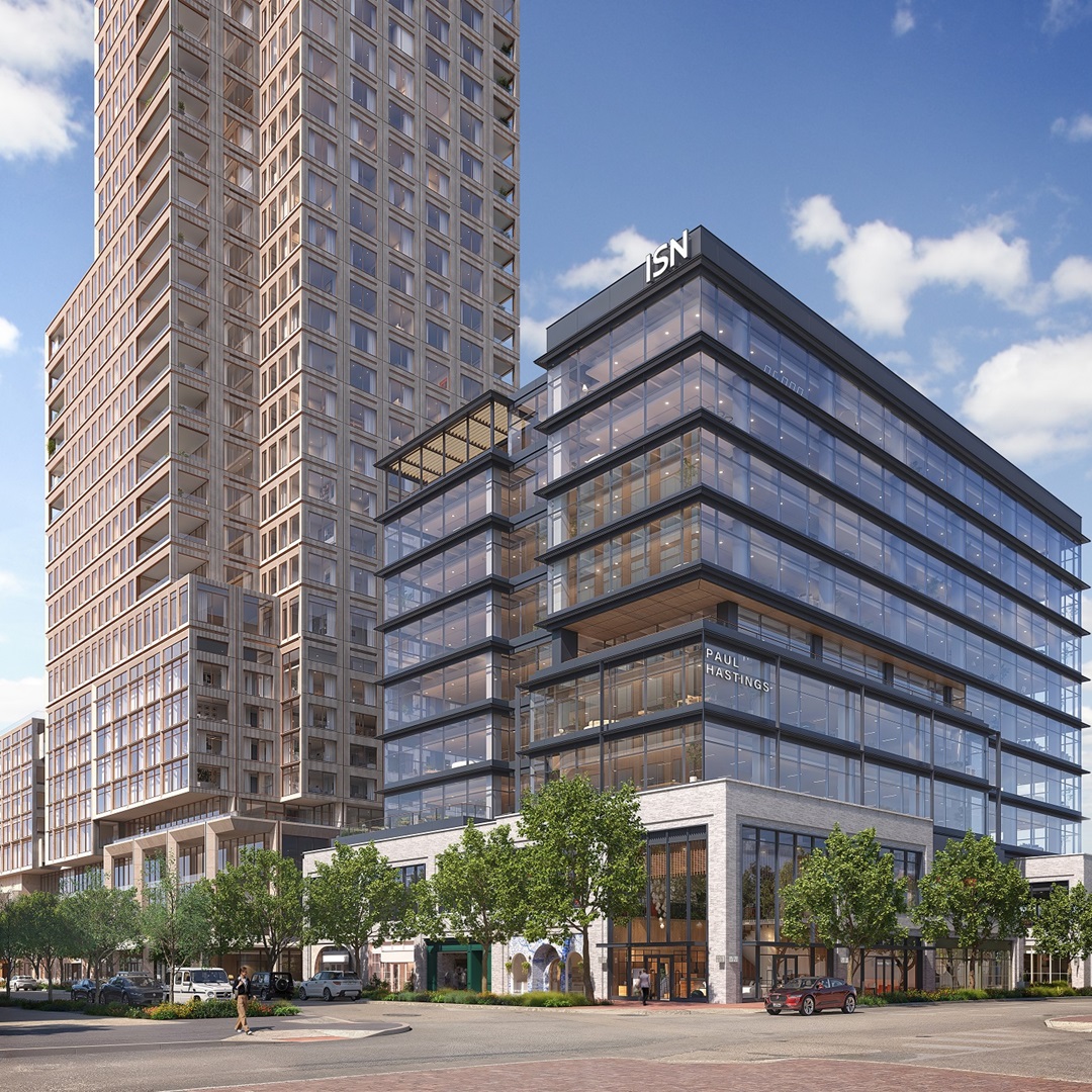 Exterior view of The Knox development featuring a glass office building and adjacent high-rise tower with street-level retail.