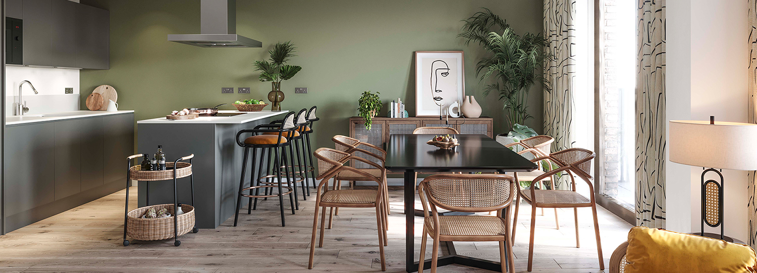 Modern kitchen with green walls, wooden chairs, and a black dining table.