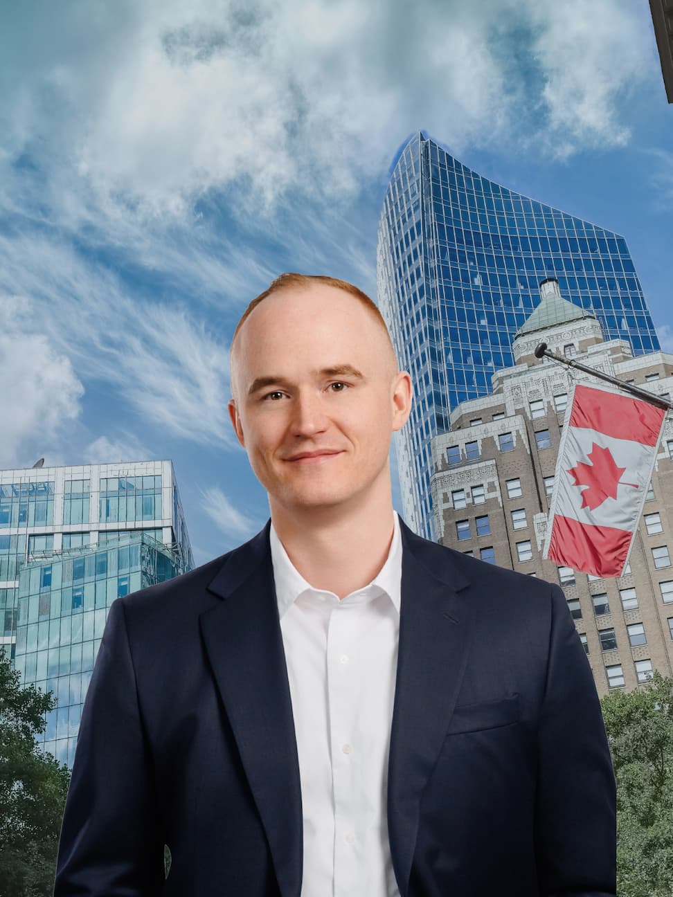 Marc Meehan standing in front of office buildings