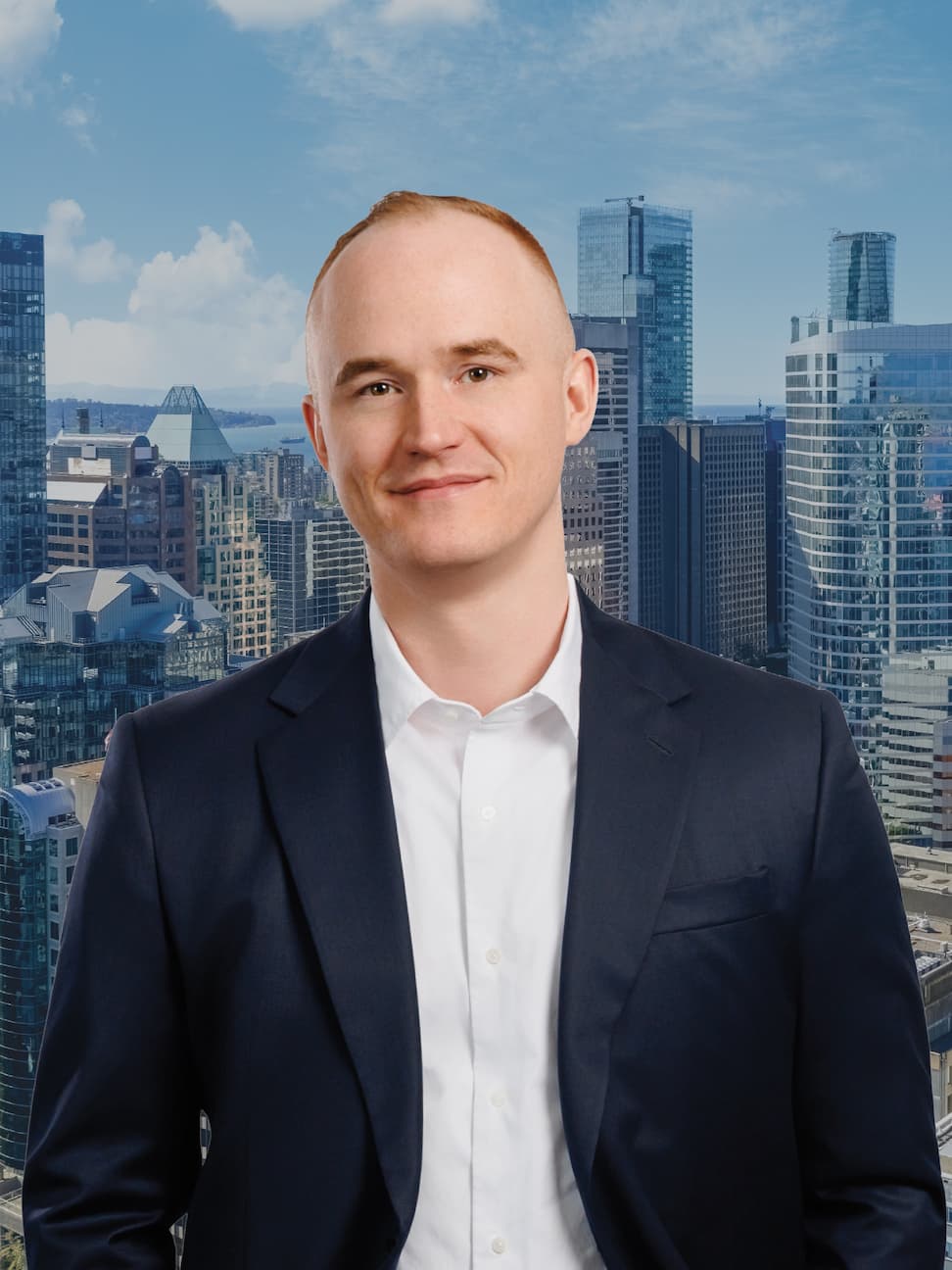 Marc Meehan standing in front of Vancouver skyline