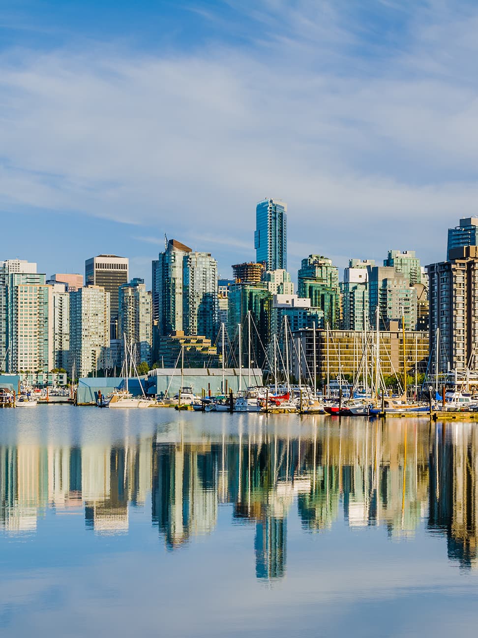Vancouver skyline with boats on water - Vancouver commercial real estate market outlook 2026