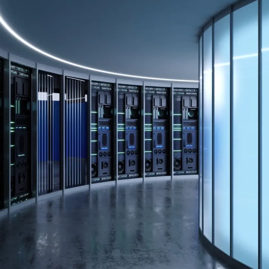 A futuristic, curved server room features rows of black server racks with glowing green and blue lights, and a wall of illuminated translucent panels on the right.