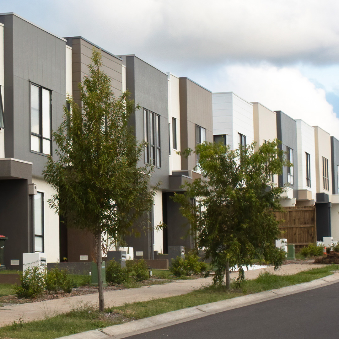 The image shows the exterior architecture of a social housing dwelling. 