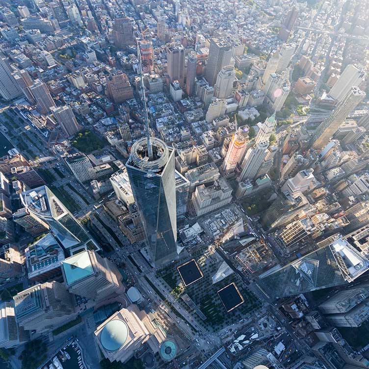 An innovative city with skyscrapers, mixed architecture and green public spaces.