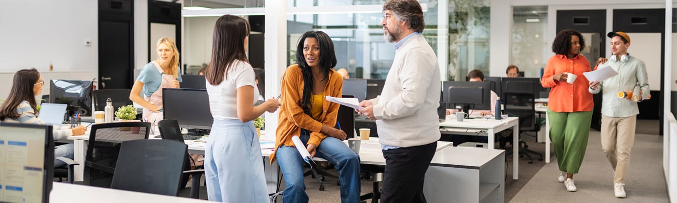 Group of colleagues working in a modern coworking office space