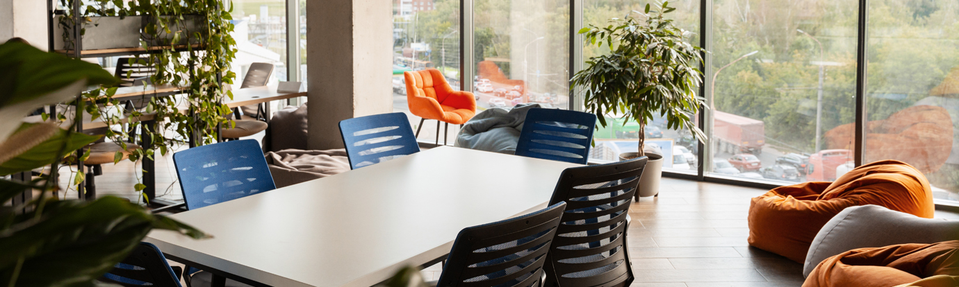Modern coworking space with plants creating relaxing atmosphere
