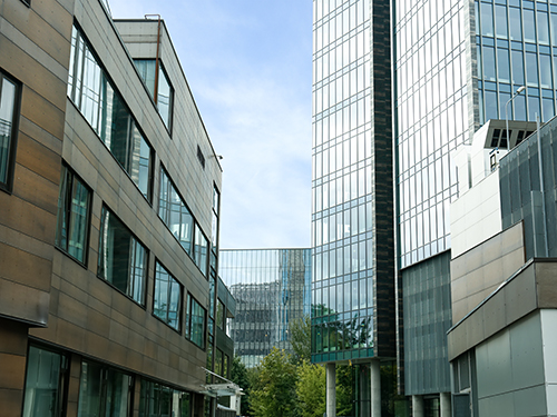 Modern office complex with glass facades and connecting walkways between buildings