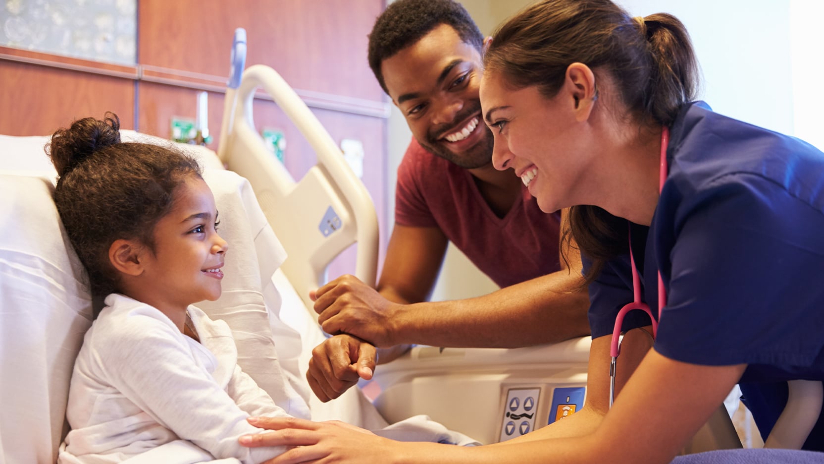 A doctor examines a patient in the hospital