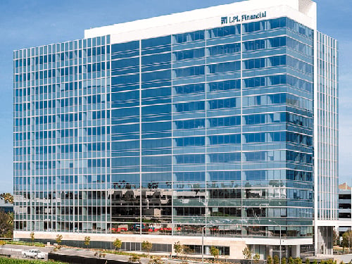 Exterior of LPL Financial headquarters, a modern Class A glass curtainwall office building with LPL Financial corporate signage on the parapet facade.