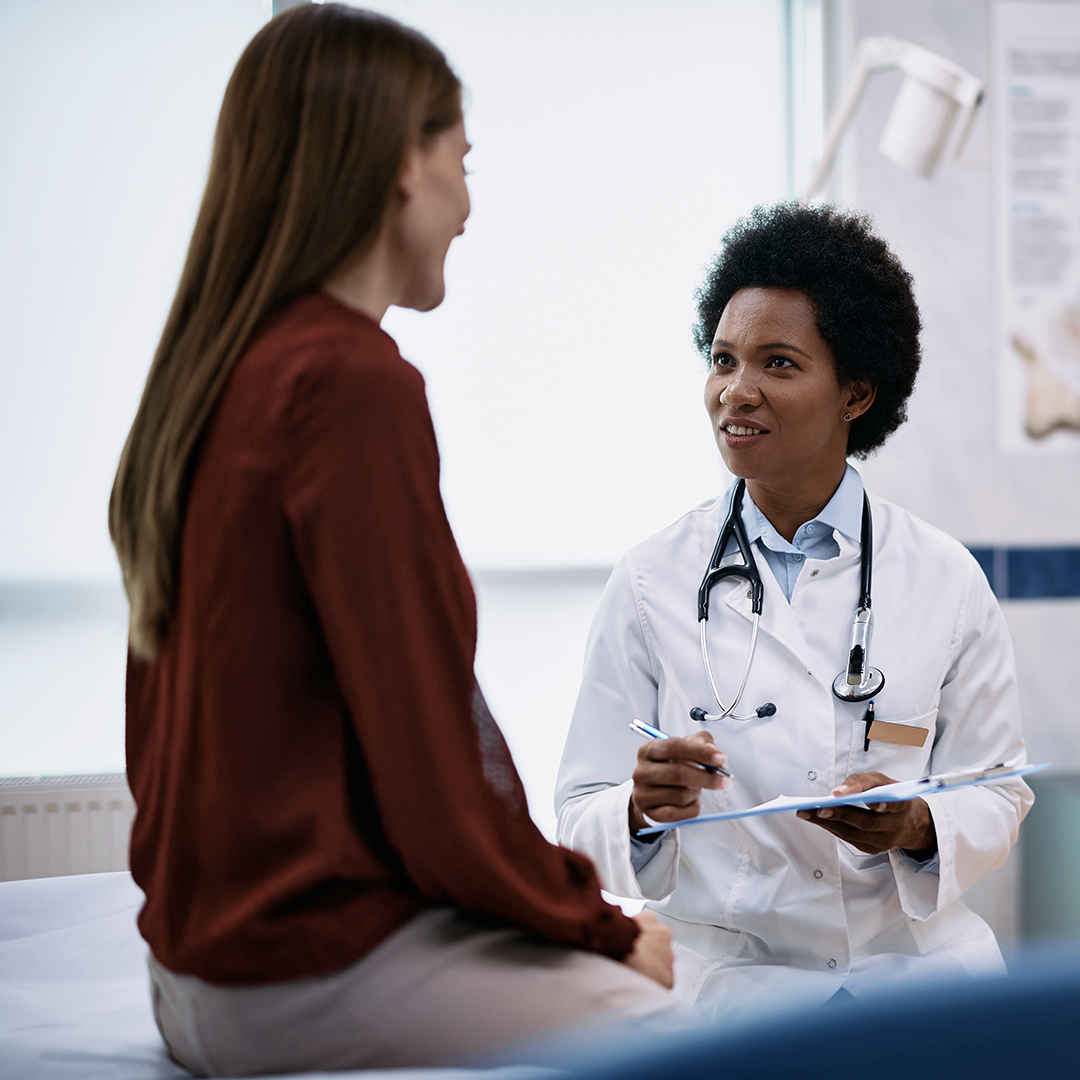 A doctor talking with a patient