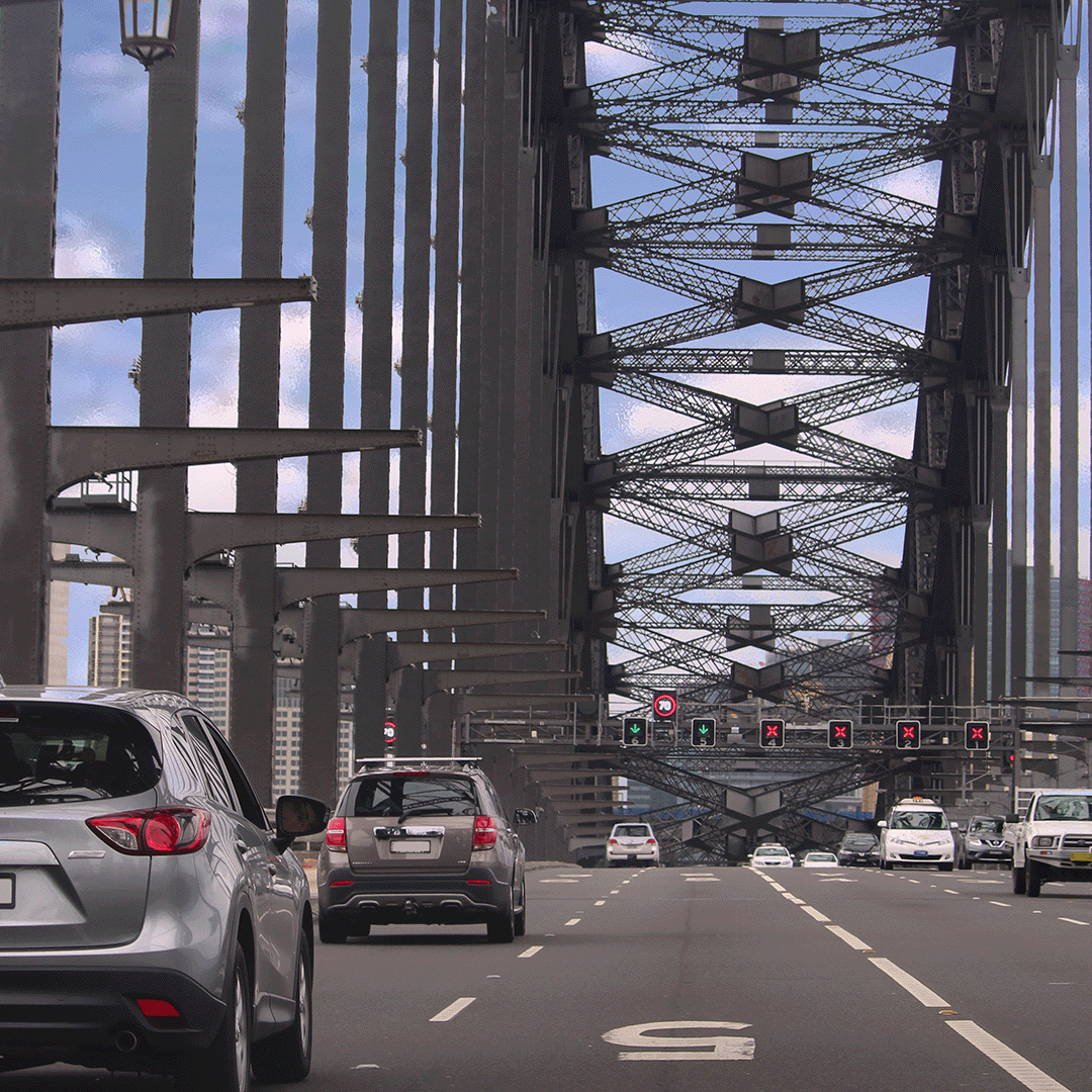 Cars driving across the Sydney Harbour Bridge.
