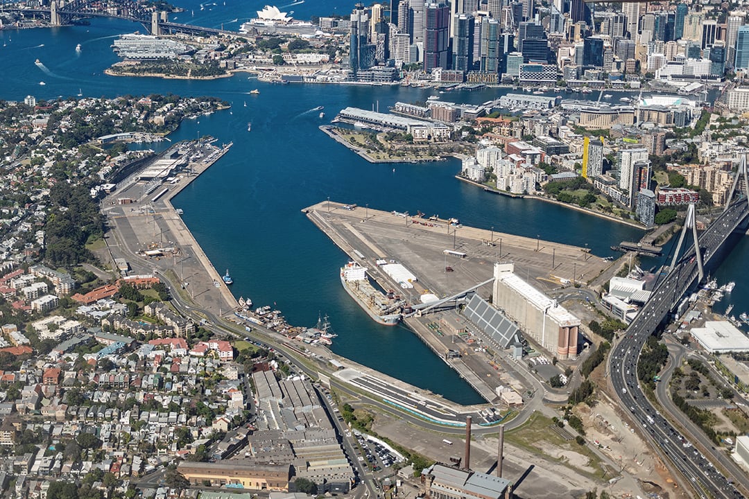 Aerial view of Sydney Harbour showing White Bay, surrounding waterfront precincts, major roads and the Sydney CBD skyline.