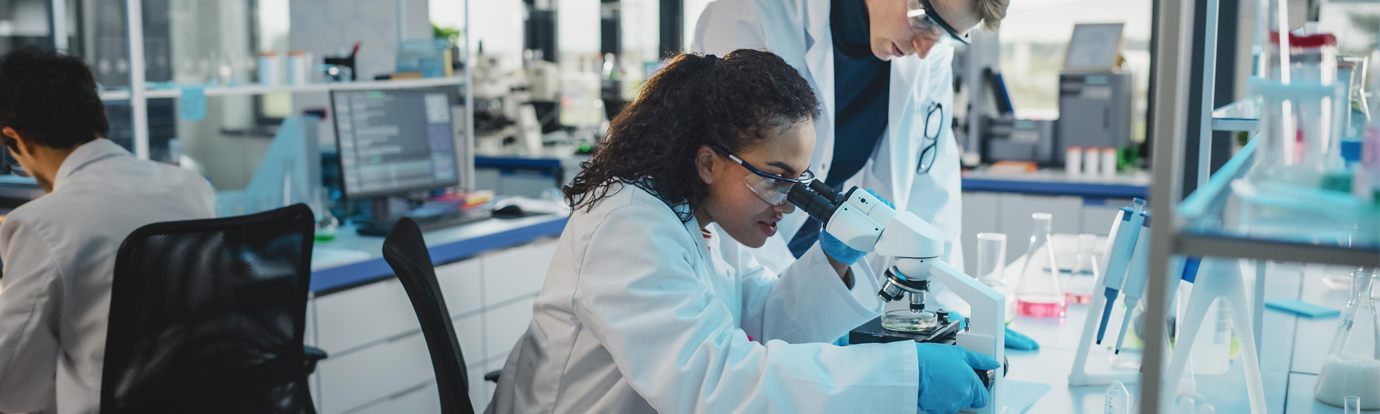 Researcher using AI-driven modelling tools supported by HPC infrastructure to accelerate molecular simulation, drug discovery in clinical trials
