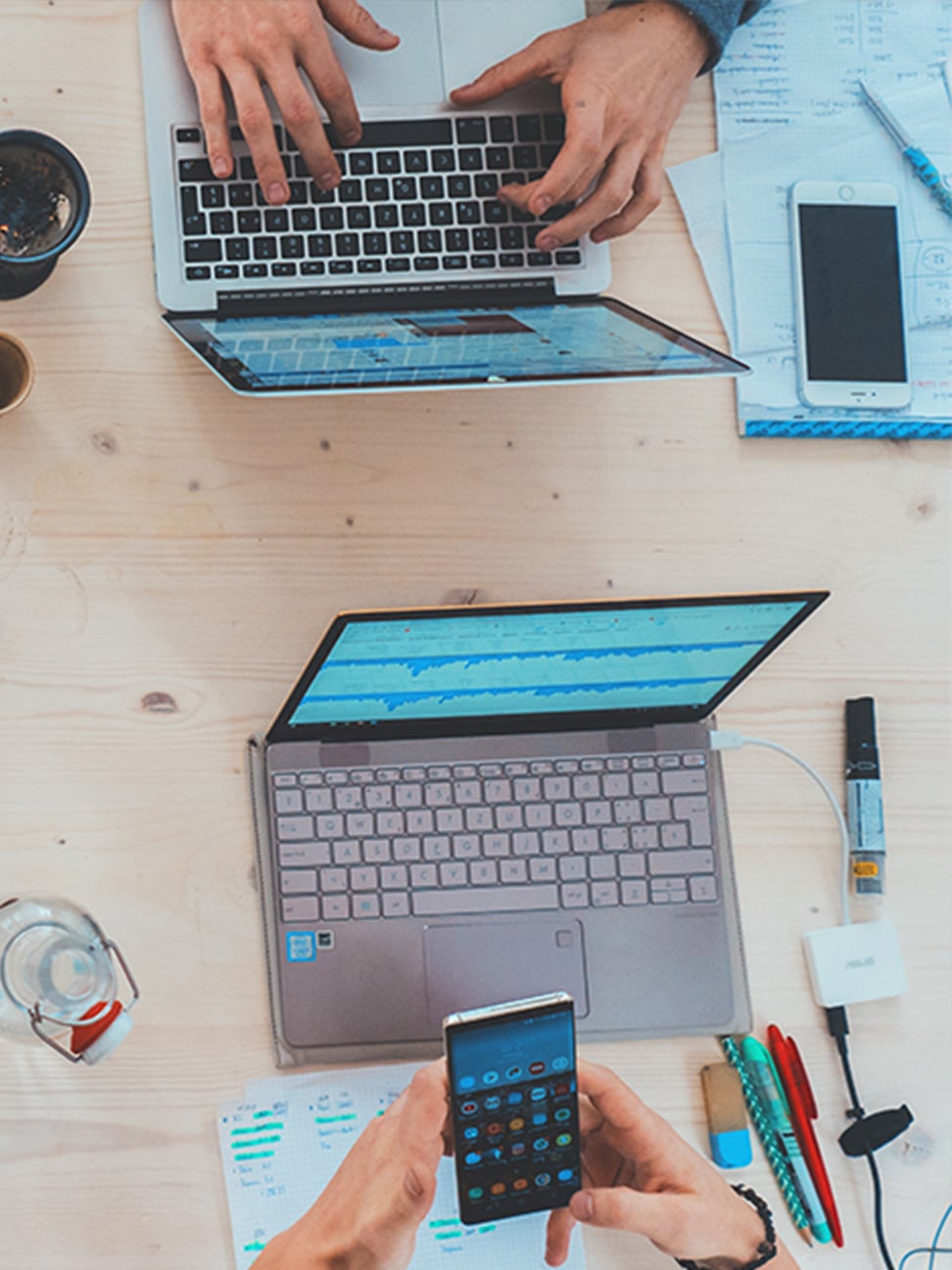 overhead view of people working on their laptops.
