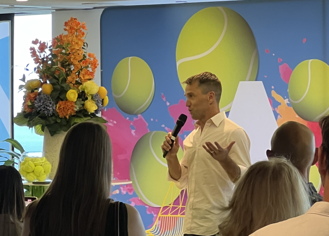 Jarrod Frazer speaks at a CBRE Australian Open client breakfast, featuring guest speaker Pat Rafter.