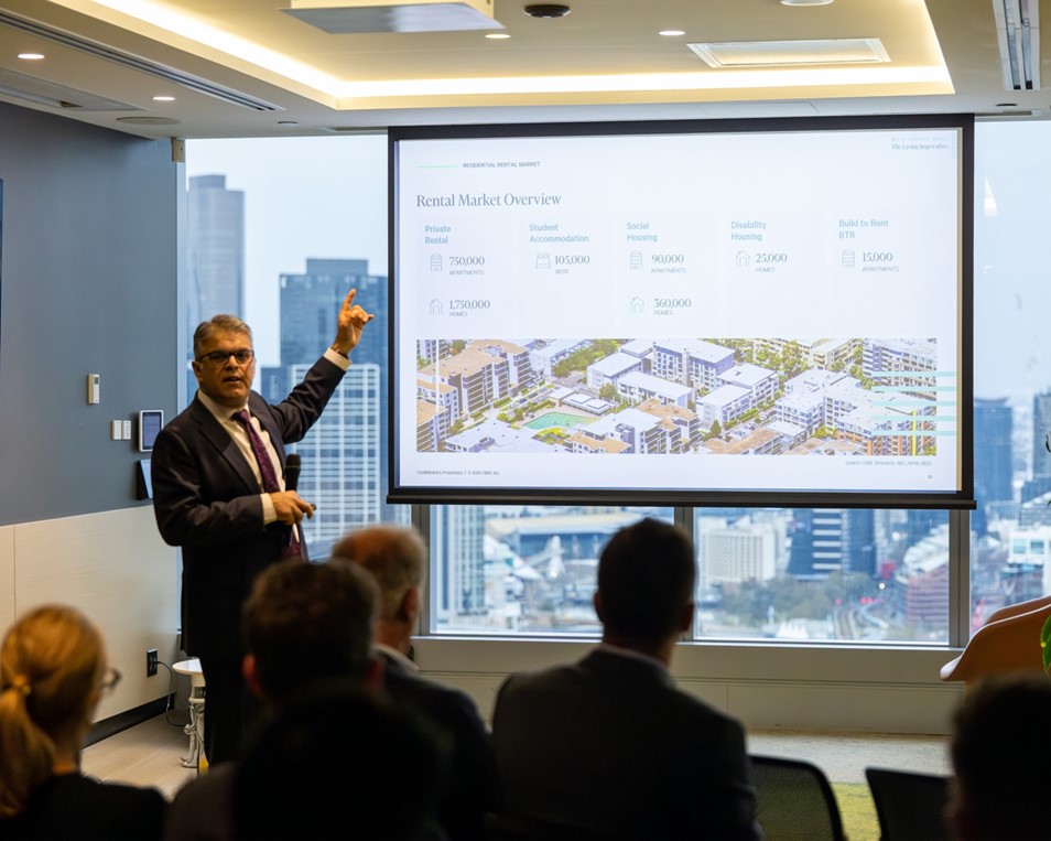 Sameer Chopra presents rental market data at The Living Imperatives event in Melbourne.