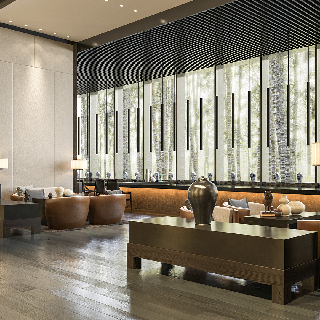 Contemporary hotel lobby with lounge seating, decorative lighting, and floor-to-ceiling windows overlooking a landscaped outdoor setting.