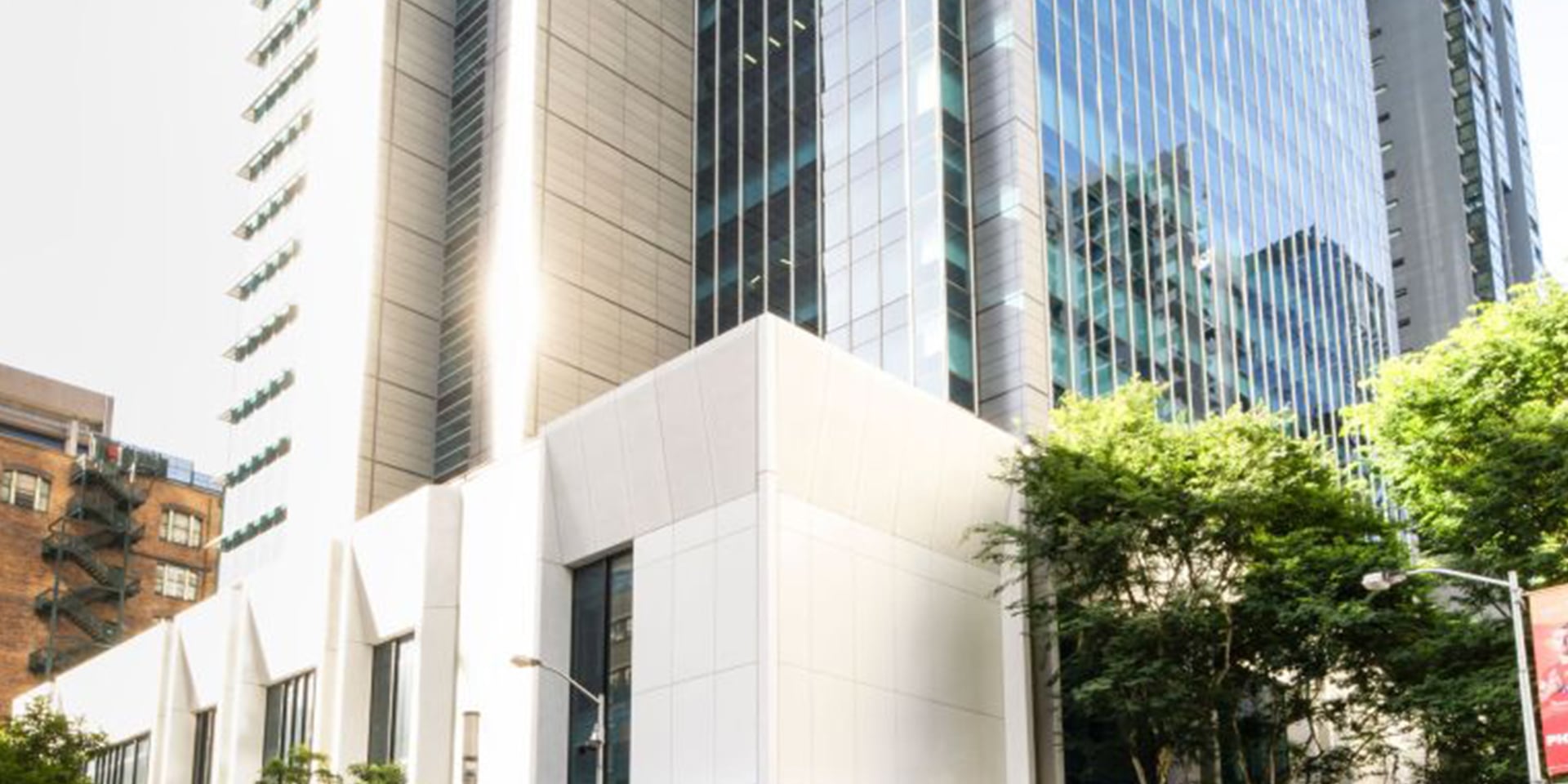 Premium office tower with a modern glass façade and prominent ground-floor lobby in a central business district location. 