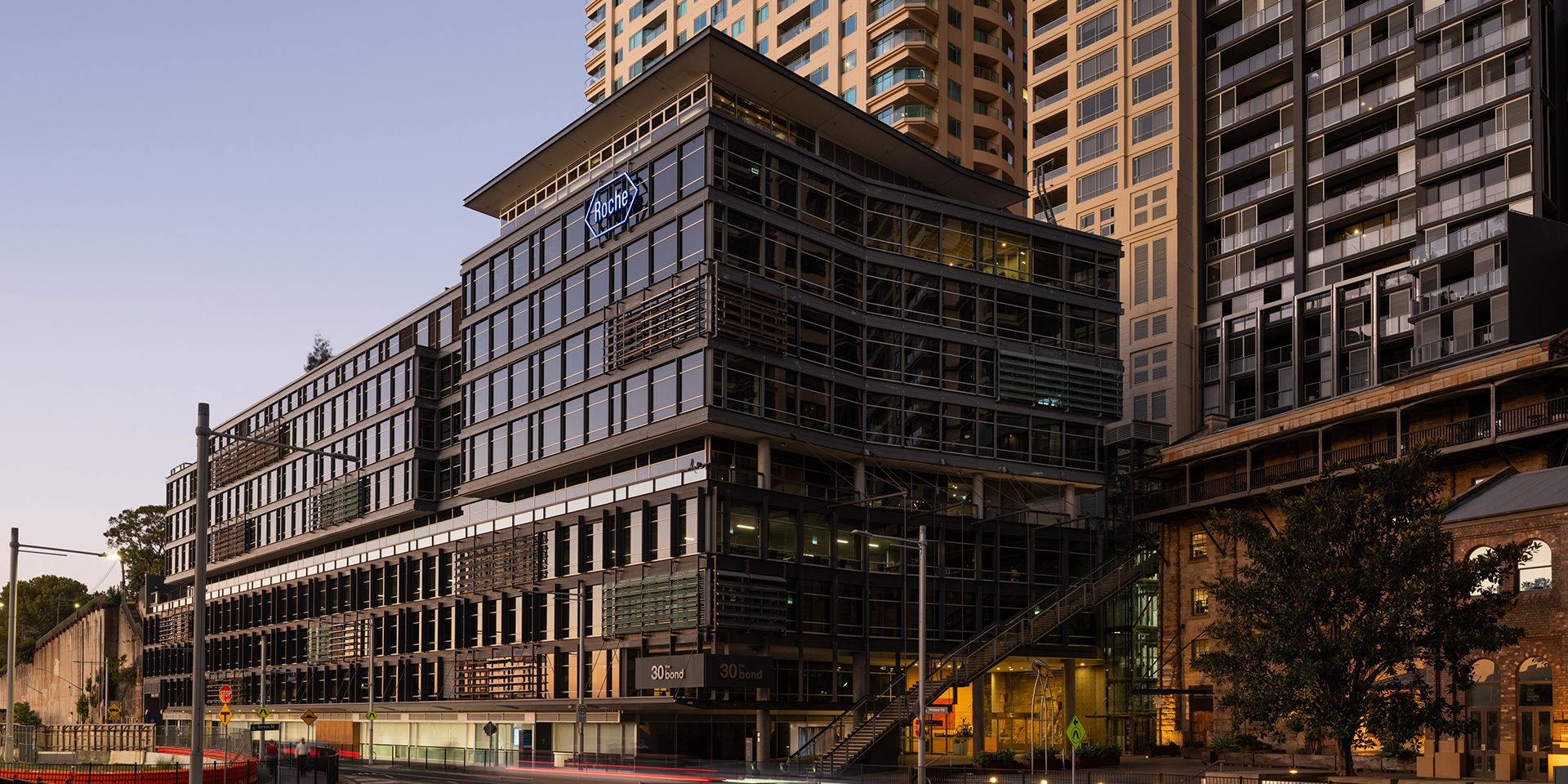 Contemporary commercial office building integrated with surrounding heritage architecture within an established urban precinct. 