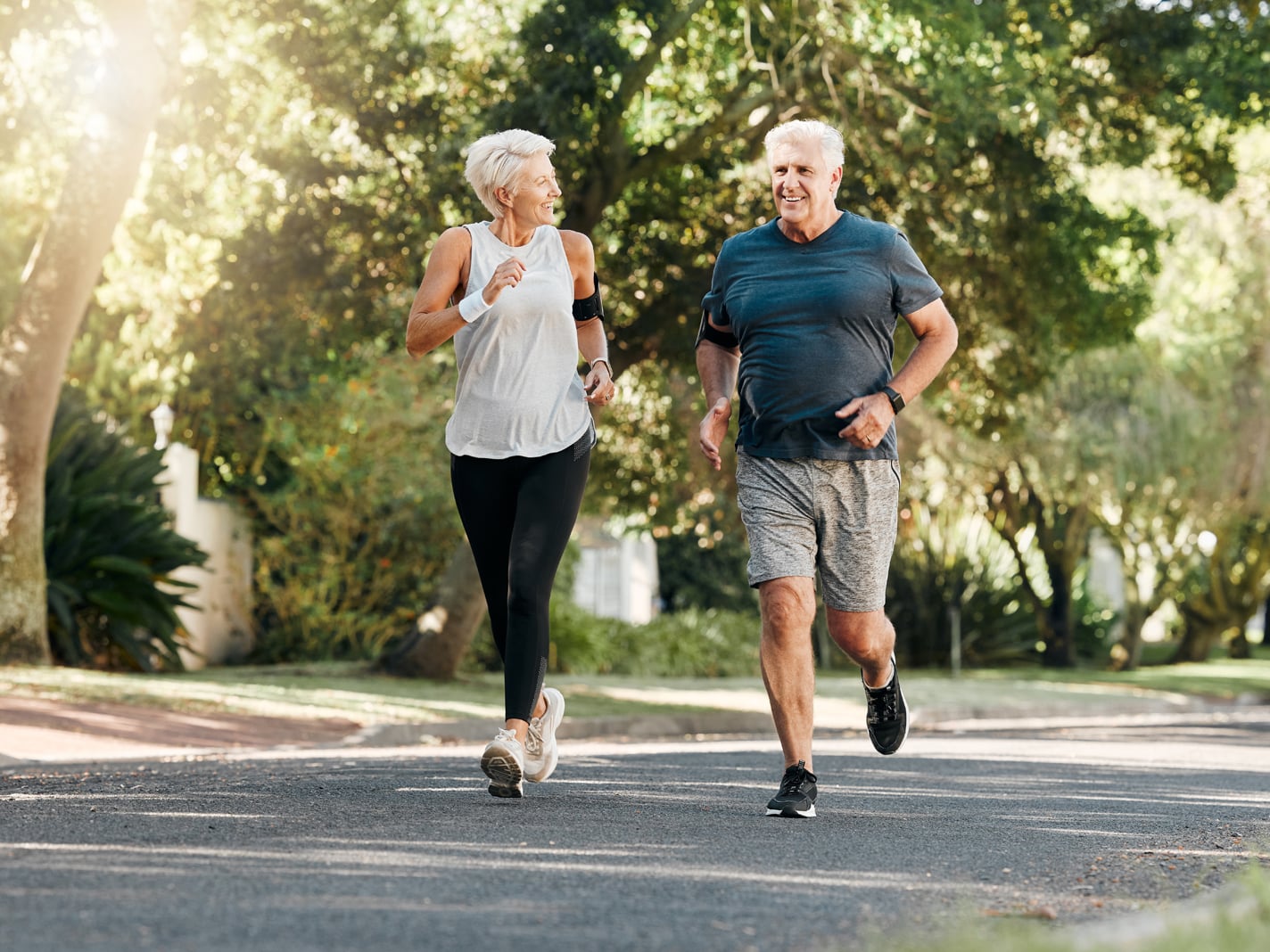 Elderly couple going for a run