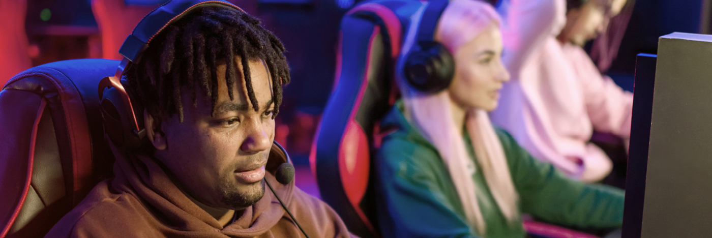 People wearing headphones and gaming