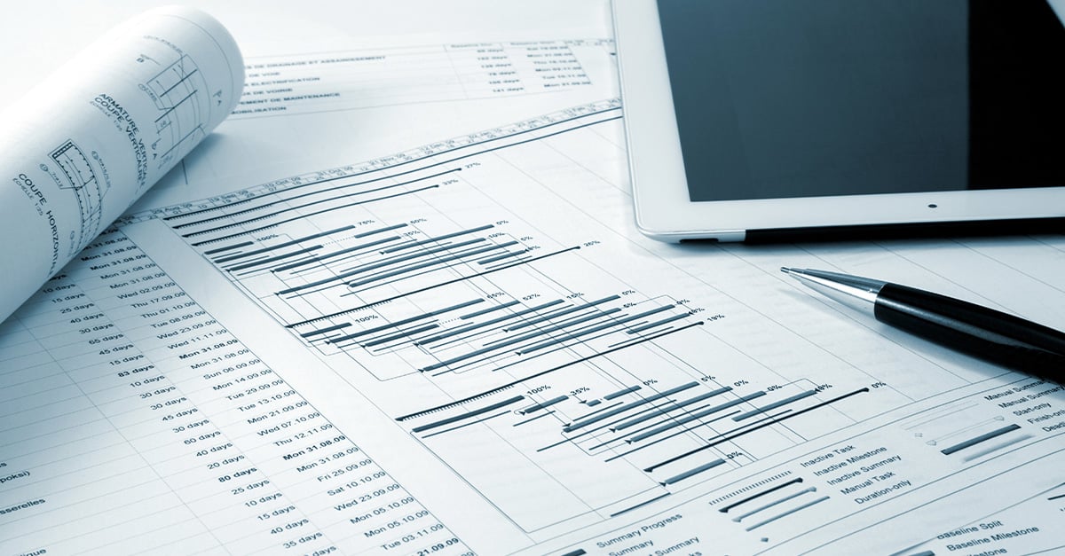 Tablet and financial papers.