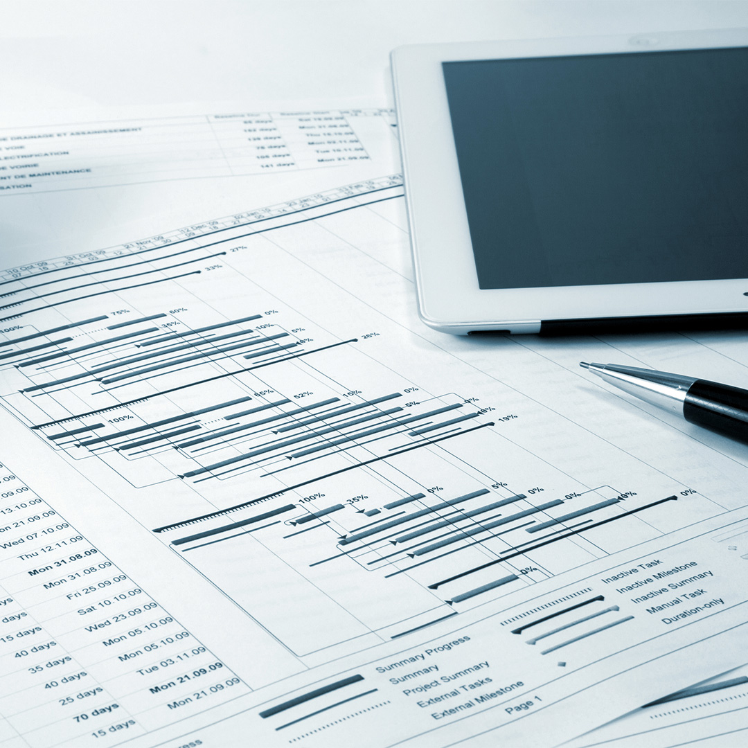 Tablet and financial papers.