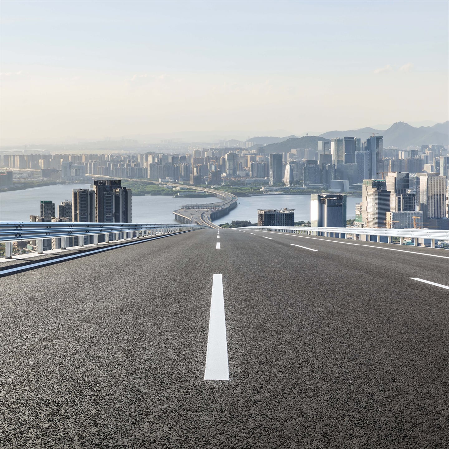 urban-infrastructure-empty-road-leading-to-downtown-hero