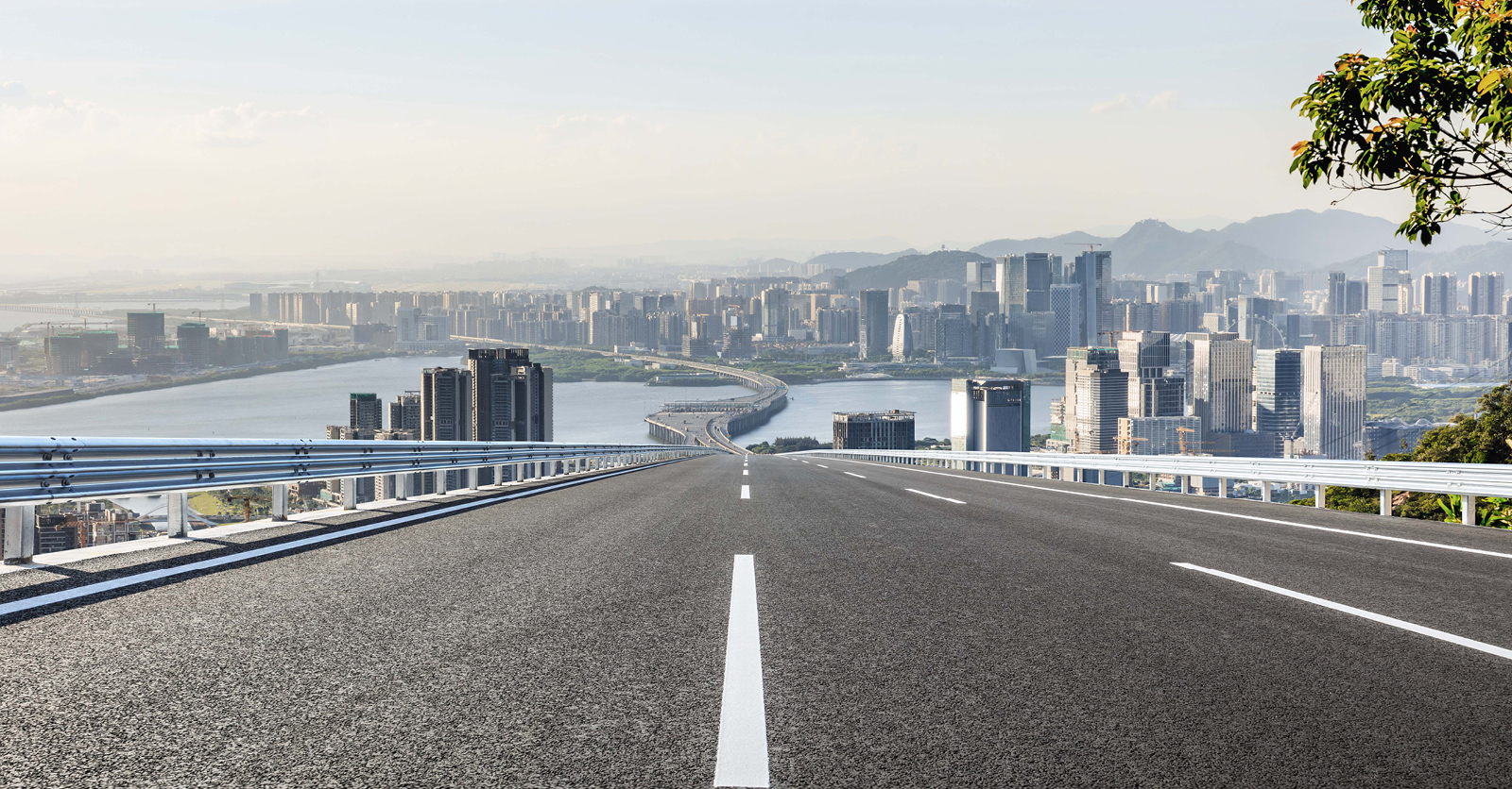urban-infrastructure-empty-road-leading-to-downtown-social
