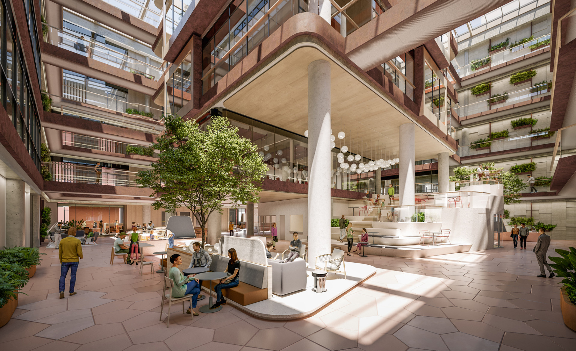 Een foto van de binnenkant van een modern gebouw met meerdere verdiepingen. Het gebouw is voorzien van een grote open ruimte en in het midden staat een boom in een gezamenlijke zitruimte.