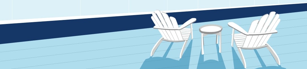 Two white Adirondack chairs and a small round table cast long blue shadows on a light blue wooden deck next to a dark blue wall with a white trim.