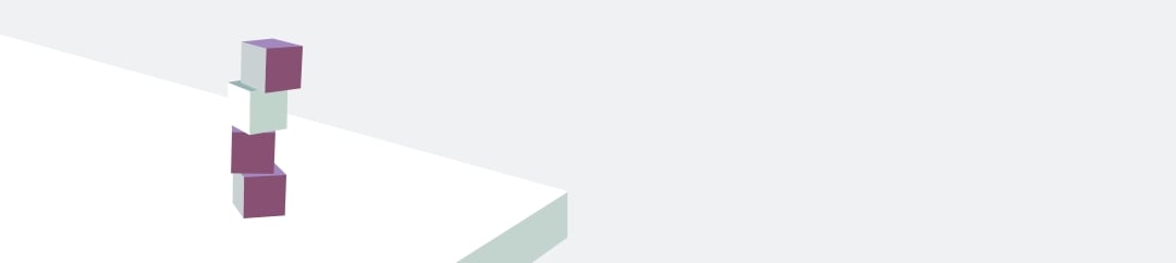 Four pastel-coloured blocks, two purple and two white, are precariously stacked on top of each other, leaning slightly to the left, on a light grey surface.