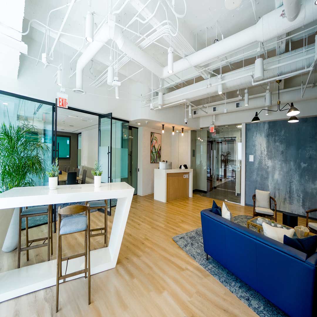 Interior lobby of CBRE Orlando office, door and front desk
