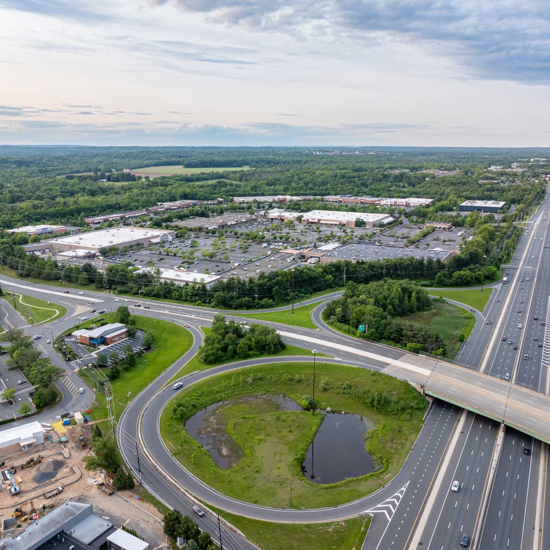 A shopping center by a freeway