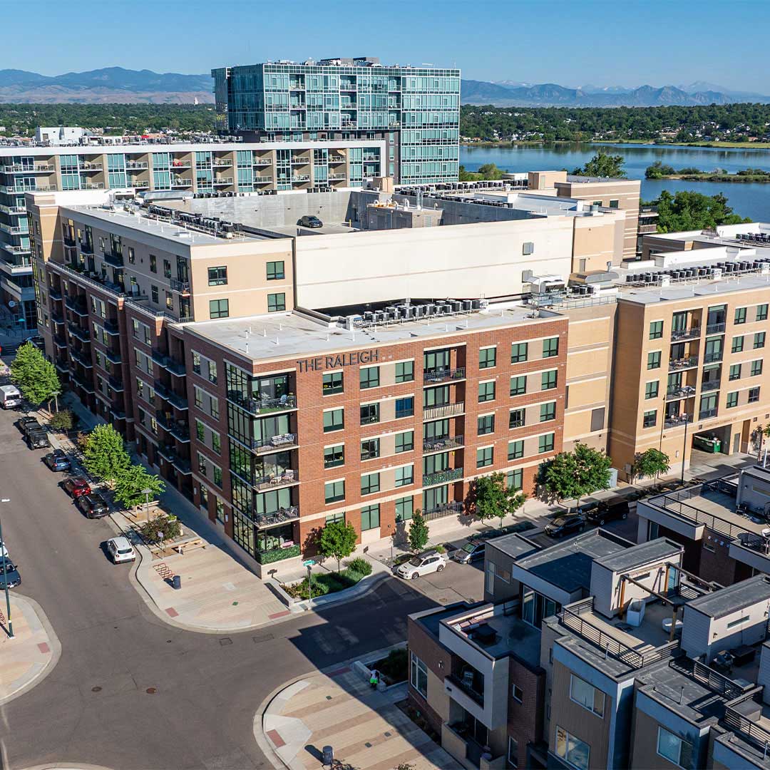 Ariel view of Raleigh at Sloan's Lake with a lake and mountains in the background