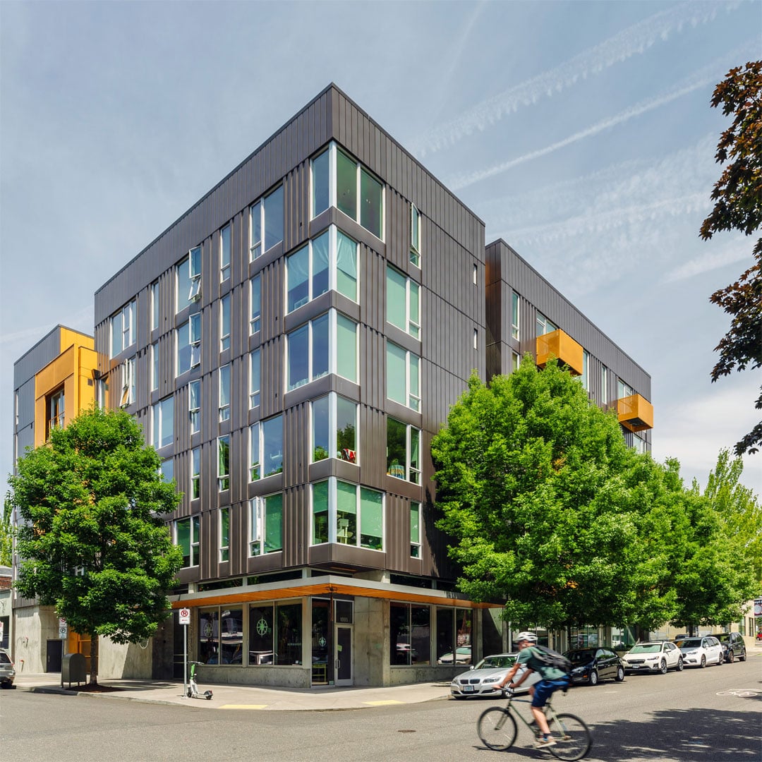 Exterior of multifamily property in Portland with green trees 