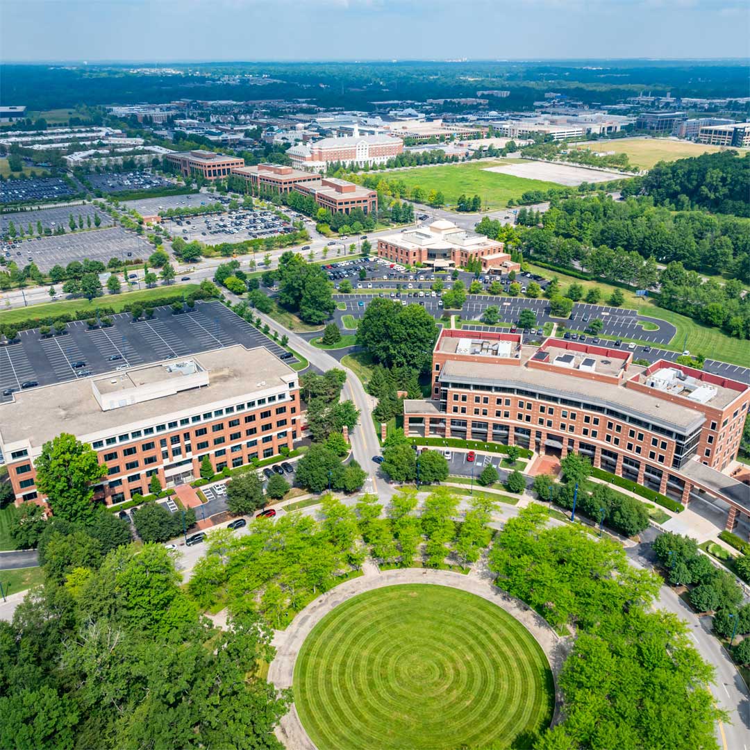 Two medium office buildings on a sunny day