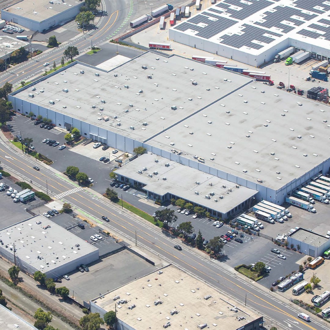 Aerial image of large industrial warehouse.