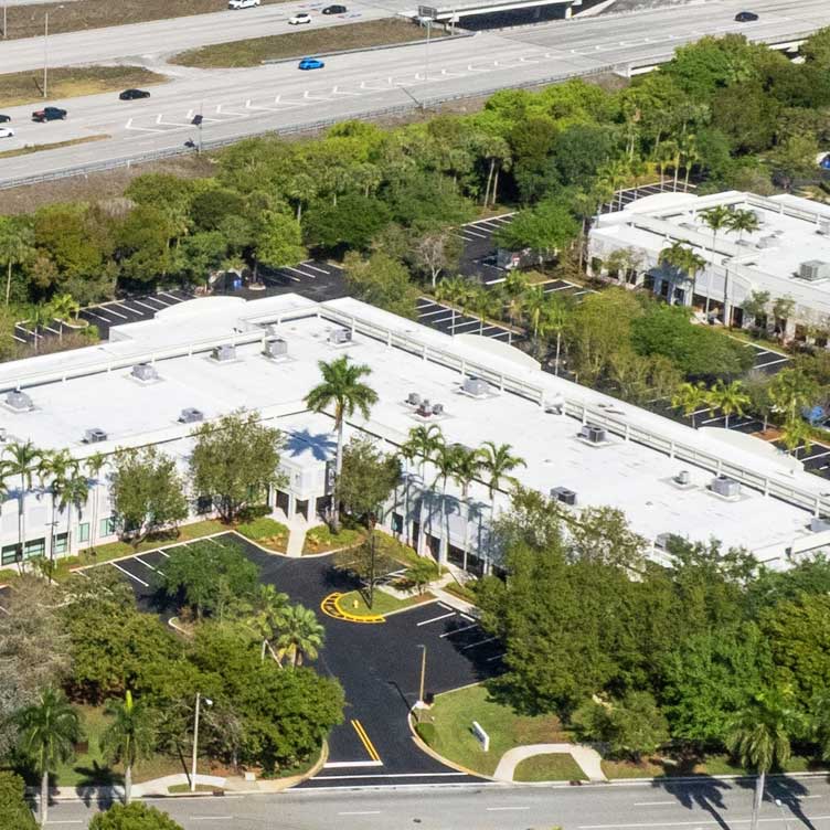 Ariel view of two office buildings near interstate