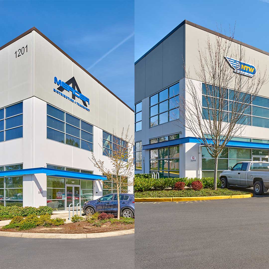 Two warehouse buildings with beige paint and blue awnings