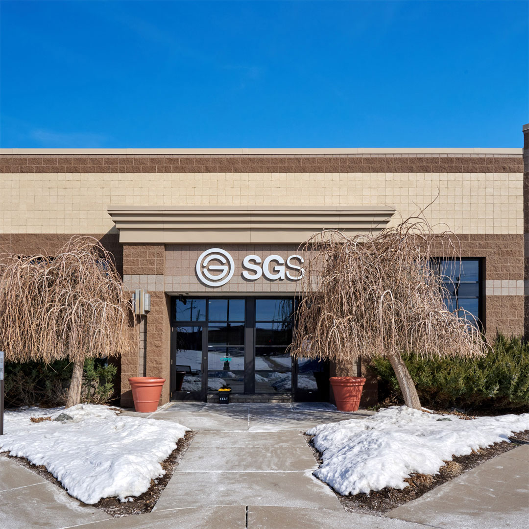 A light tan industrial warehouse on a winter day