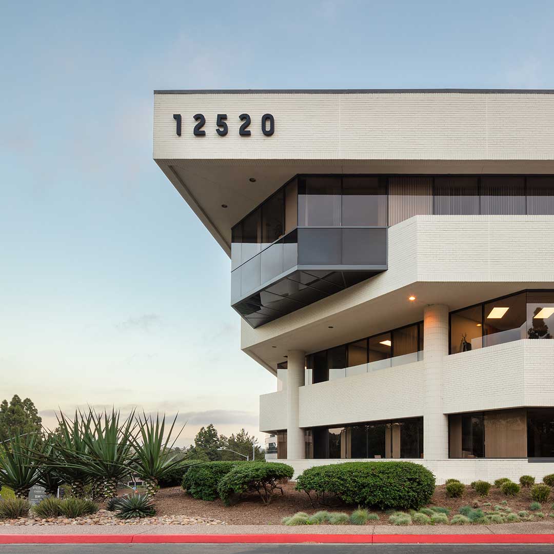 Modern office building at Plaza Del Mar, San Diego, California, featuring contemporary architecture and landscaped surroundings.