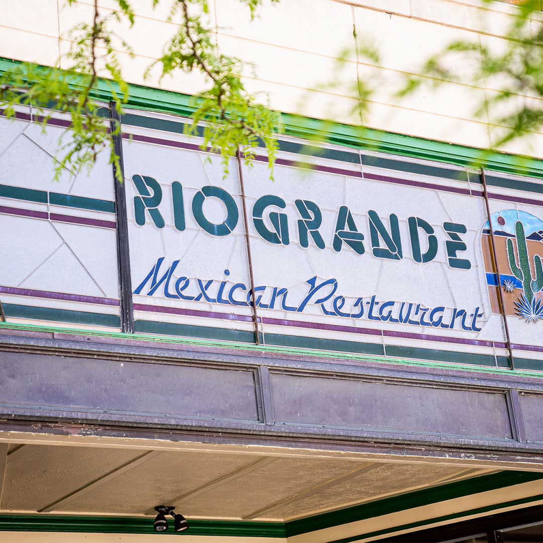 Rio Grande Mexican Restaurant exterior sign on a strip mall building, featuring branded lettering and storefront details.